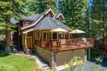 Nestled amidst towering pine trees, this charming mountain home offers a serene retreat.