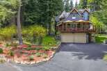 Nestled amidst towering trees, this stunning multi-level home offers a serene retreat.