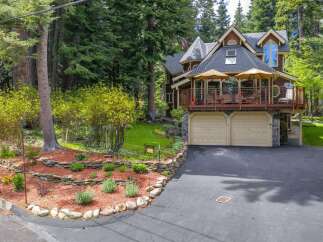 Nestled amidst towering trees, this stunning multi-level home offers a serene retreat.