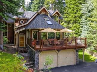 Nestled amidst towering trees, this charming wooden home offers a serene mountain retreat.