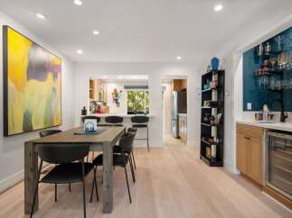 Experience modern living in this open-concept dining and kitchen area, perfect for entertaining.