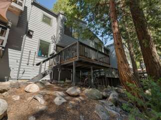 Nestled amongst mature trees, this multi-level home offers a unique mountain retreat.