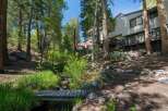 Nestled amidst towering trees and a serene forest setting, this property offers a unique blend of natural beauty and modern living.