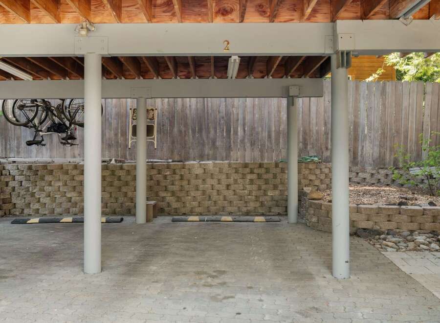 Discover this versatile covered parking space, perfect for protecting your vehicles from the elements.