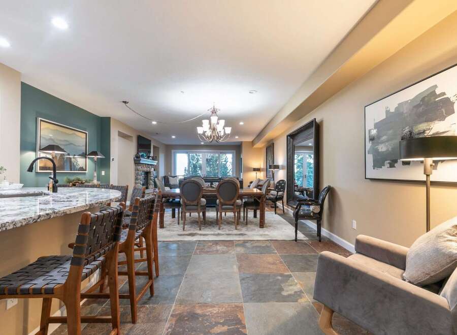 Experience elegant open-concept living with a spacious dining area and a modern kitchen island, perfect for entertaining.