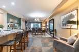 Experience elegant open-concept living with a spacious dining area and a modern kitchen island, perfect for entertaining.