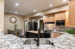 Experience the heart of this home with a stunning kitchen featuring granite countertops and a spacious island.
