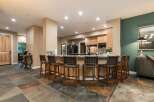 Experience seamless entertaining in this stunning kitchen and dining area, featuring a spacious granite island with comfortable bar seating.