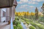 Experience luxury living with this stunning property offering breathtaking mountain views and lush landscaping.