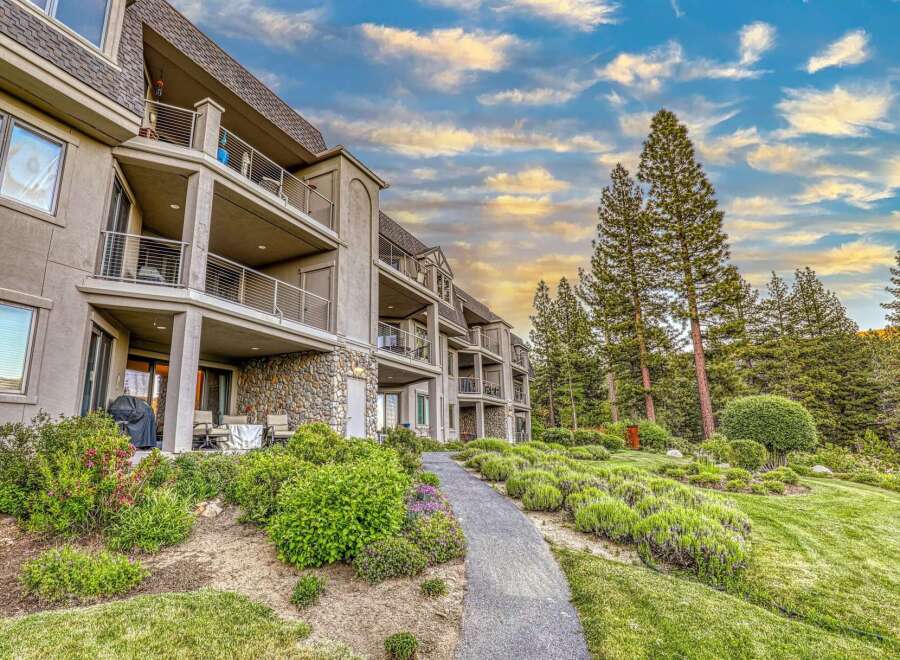 Experience luxury living in this stunning multi-level condo, featuring private balconies with breathtaking views and a stone-accented lower level.