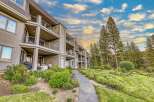 Experience luxury living in this stunning multi-level condo, featuring private balconies with breathtaking views and a stone-accented lower level.