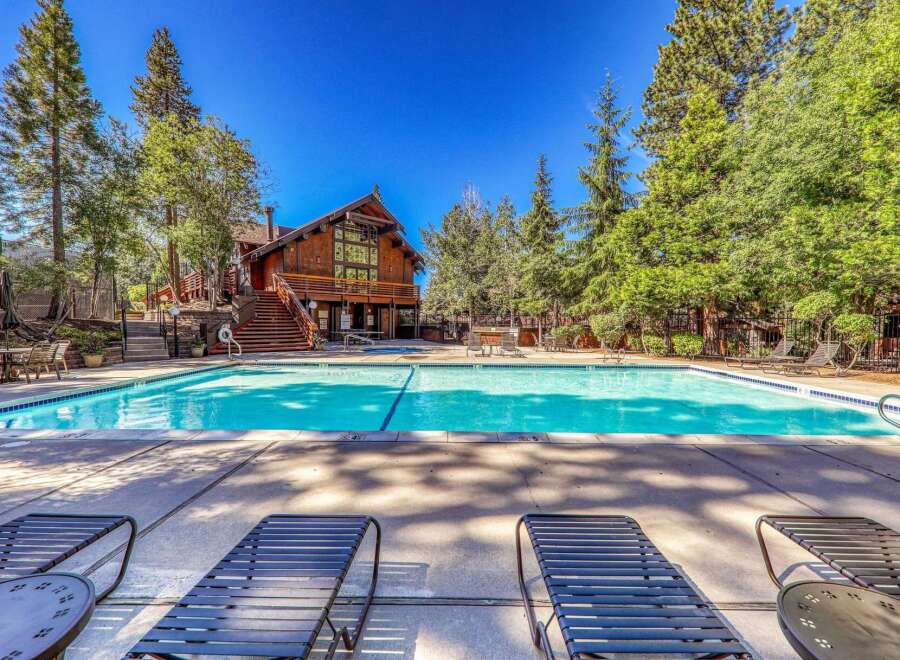 Enjoy a refreshing dip in this stunning swimming pool, perfect for a sunny day.