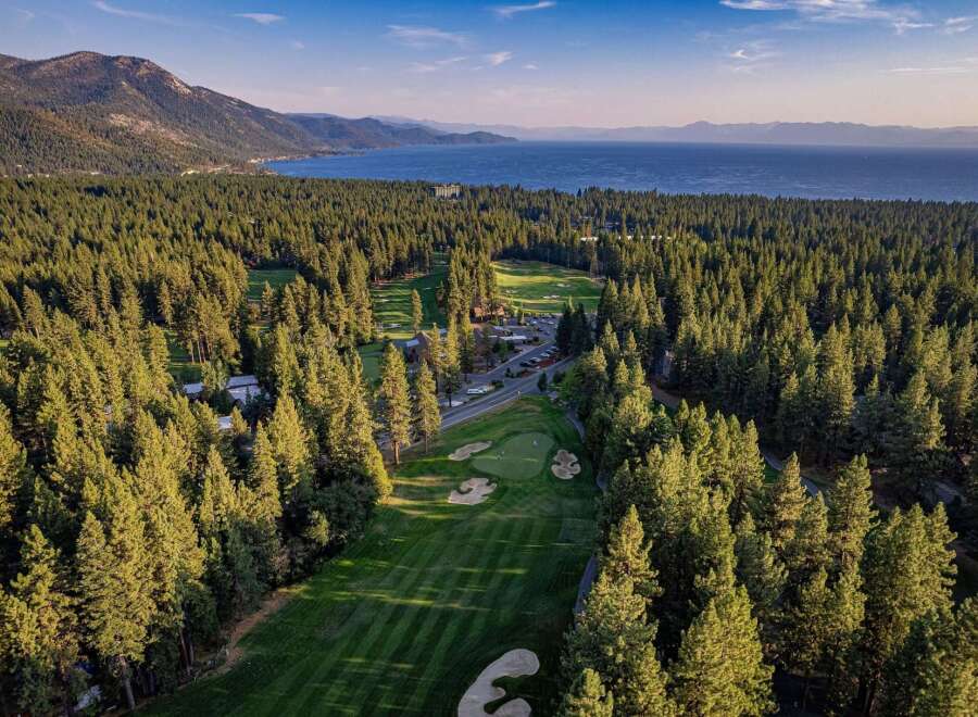 Experience luxury living nestled amidst a pristine pine forest with breathtaking views of Lake Tahoe.