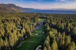 Experience luxury living nestled amidst a pristine pine forest with breathtaking views of Lake Tahoe.