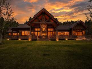 Experience rustic luxury in this stunning log cabin home, perfectly situated amidst a serene natural landscape.