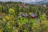 Nestled amidst a lush pine forest and rolling hills, this stunning mountain retreat offers unparalleled natural beauty and serene living.
