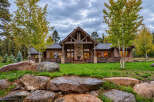 Experience rustic luxury in this stunning log cabin home, nestled amidst a picturesque landscape.