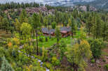 Nestled amidst a lush forest and a babbling creek, this stunning mountain home offers unparalleled tranquility and natural beauty.