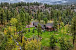 Nestled amidst a lush forest and rolling hills, this stunning property offers a serene mountain retreat.