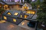Experience modern luxury in this stunning property featuring a sleek metal roof and integrated solar panels for sustainable living.