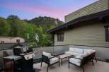 Enjoy breathtaking mountain views from this stunning rooftop patio, perfect for entertaining or relaxing.