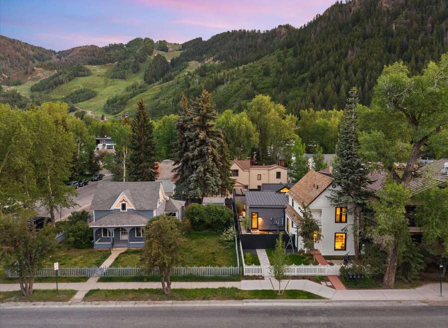 Nestled against a backdrop of majestic mountains and lush forests, this charming property offers a serene escape.