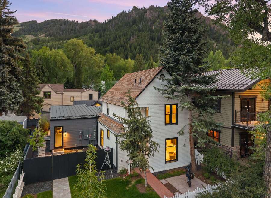 Nestled against a backdrop of majestic mountains, this charming property offers a serene escape.