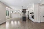 Experience modern living in this stunning open-concept kitchen and dining area.