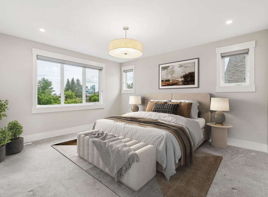 Experience luxurious comfort in this beautifully appointed bedroom, featuring a spacious king-sized bed with plush bedding and decorative pillows.