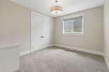 This bright and airy bedroom features a large double door closet, perfect for ample storage.