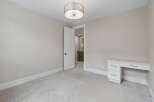 Discover this charming room, perfect for a home office or a cozy bedroom.
