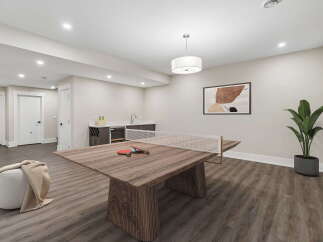This modern basement features a versatile space perfect for entertainment and relaxation.