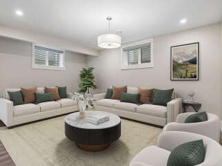This inviting living room features a spacious layout with two comfortable sofas and two accent chairs, perfect for entertaining guests.
