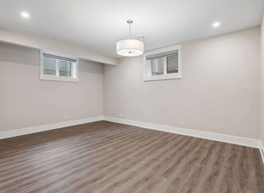 Discover this spacious and bright unfinished basement, perfect for customization.