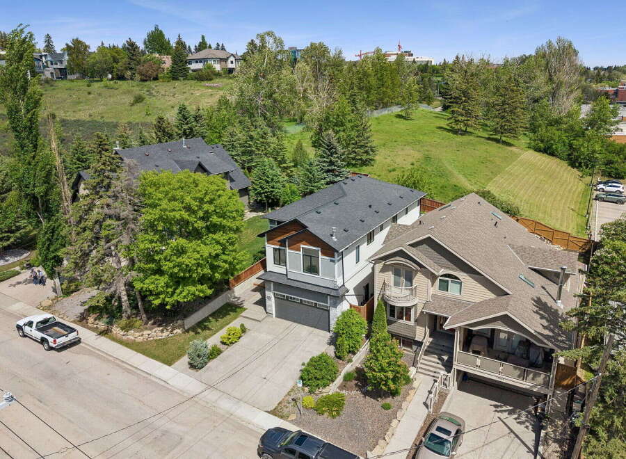 Discover this stunning multi-level home offering a modern aesthetic with striking architectural details.