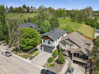 Discover this stunning multi-level home offering a modern aesthetic with striking architectural details.