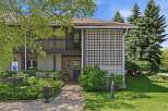 Discover this charming property featuring a welcoming brick entrance and a decorative white lattice screen.