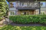 Enjoy outdoor living with a spacious balcony and a lower patio area, perfect for entertaining or relaxing.