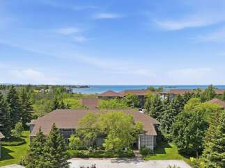 Experience serene living with this stunning property offering breathtaking views of the water.