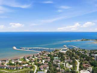 Experience waterfront living at its finest with this stunning aerial view of a coastal community.