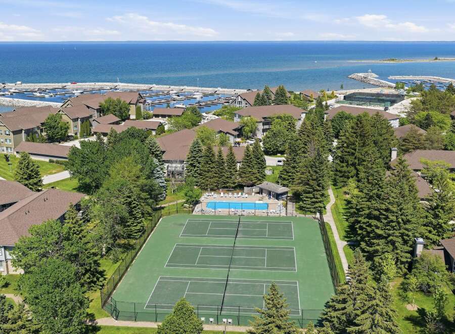 Experience resort-style living with this stunning aerial view showcasing a vibrant community.