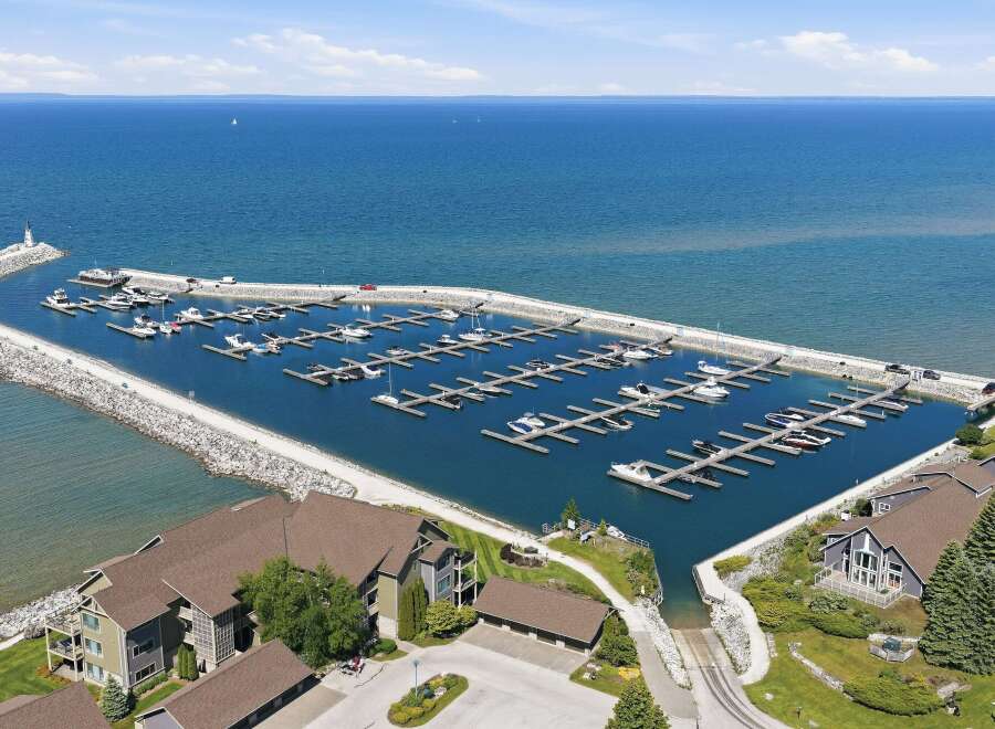 Experience luxury waterfront living with this stunning property featuring a private marina and breathtaking lake views.
