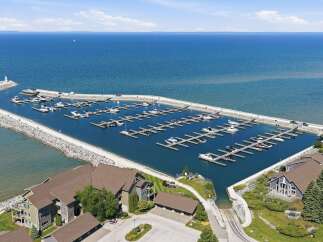 Experience luxury waterfront living with this stunning property featuring a private marina and breathtaking lake views.