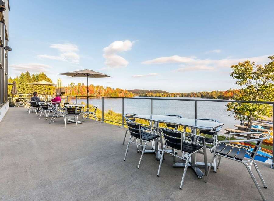 Enjoy breathtaking lake views from this stunning patio, perfect for al fresco dining or relaxing with a drink.