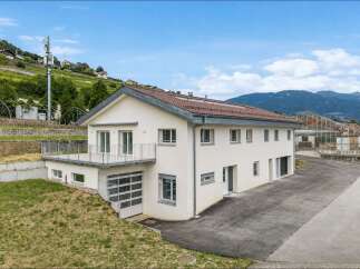 Discover this modern, multi-story home featuring a spacious balcony with scenic views and a convenient garage door.