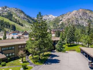 Nestled against a stunning mountain backdrop, this property offers a serene retreat with convenient access to outdoor adventures.