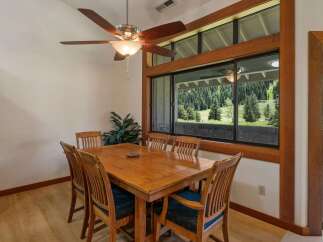 Enjoy breathtaking mountain views from this charming dining area, perfect for intimate meals or lively gatherings.