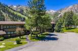 Experience mountain living in this stunning property, nestled against a backdrop of majestic, snow-capped peaks and lush green slopes.