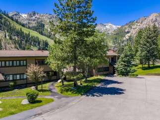 Experience mountain living in this stunning property, nestled against a backdrop of majestic, snow-capped peaks and lush green slopes.