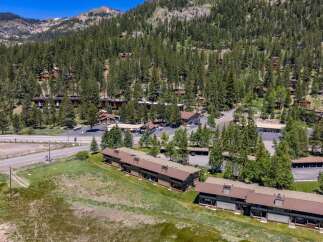 Nestled amidst a dense pine forest and rolling hills, this property offers a serene mountain retreat.